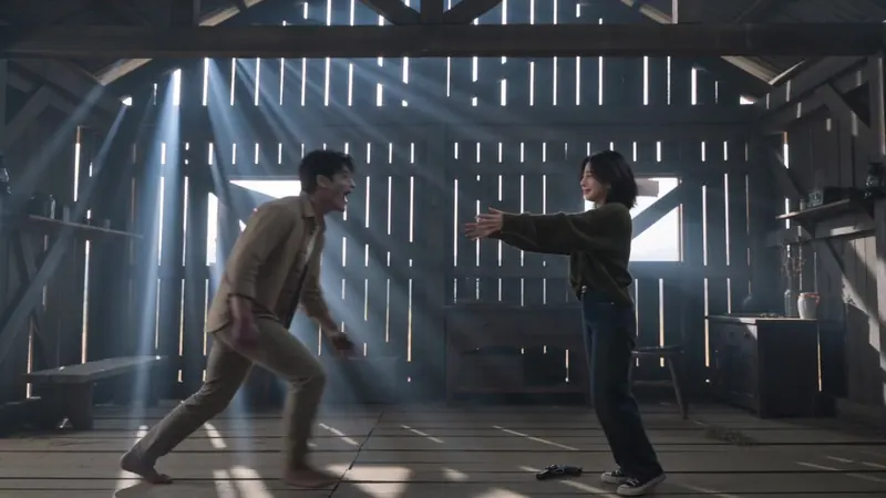 The two characters move toward each other in the cabin